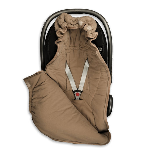 Lodger Bunker Mini guļammaiss Beige krāsā. Redzams ielikts autokrēsliņā.